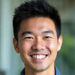 Kai Chen, Adventure Specialist, smiling warmly.