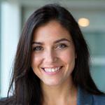 Sophia Rodriguez, Group Travel Coordinator, smiling genuinely.